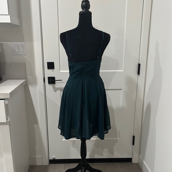 Green mini sundress with pleated skirt and spaghetti strap v-neck for cocktail - Picture 3 of 3